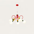 Five-head Clérachic pendant with its red canopy, red looping tubes and frosted globes on a warm-white backdrop.