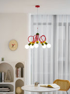 Clérachic pendant on a red ceiling plate, hung beside sheer curtains and a wall clock over a small round table.