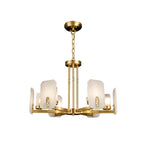 Clérachic Meridian Alabaster Chandelier in its six-light span, unlit on white, brass spokes fanning out under the chain and canopy.