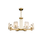 Clérachic Meridian Alabaster Chandelier lit on white, warm light glowing through the alabaster while the glass keeps each bulb crisp.