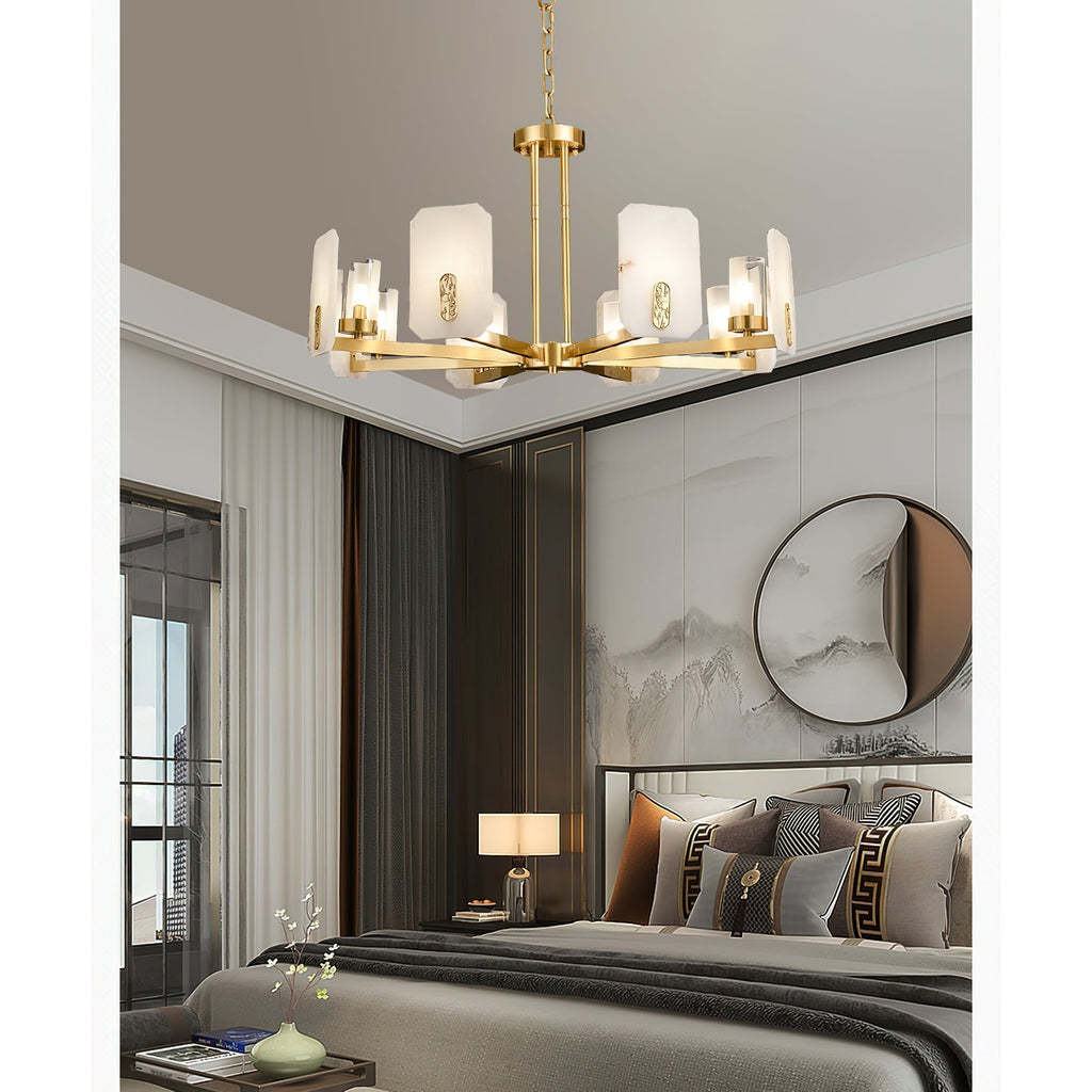 Clérachic Meridian Alabaster Chandelier in a bedroom, lit above the bed with its stone panels catching the tray-ceiling light.