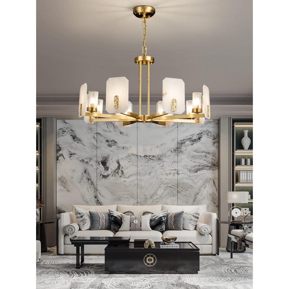 Clérachic Meridian Alabaster Chandelier over a cream sofa, hanging in front of a book-matched grey marble feature wall.