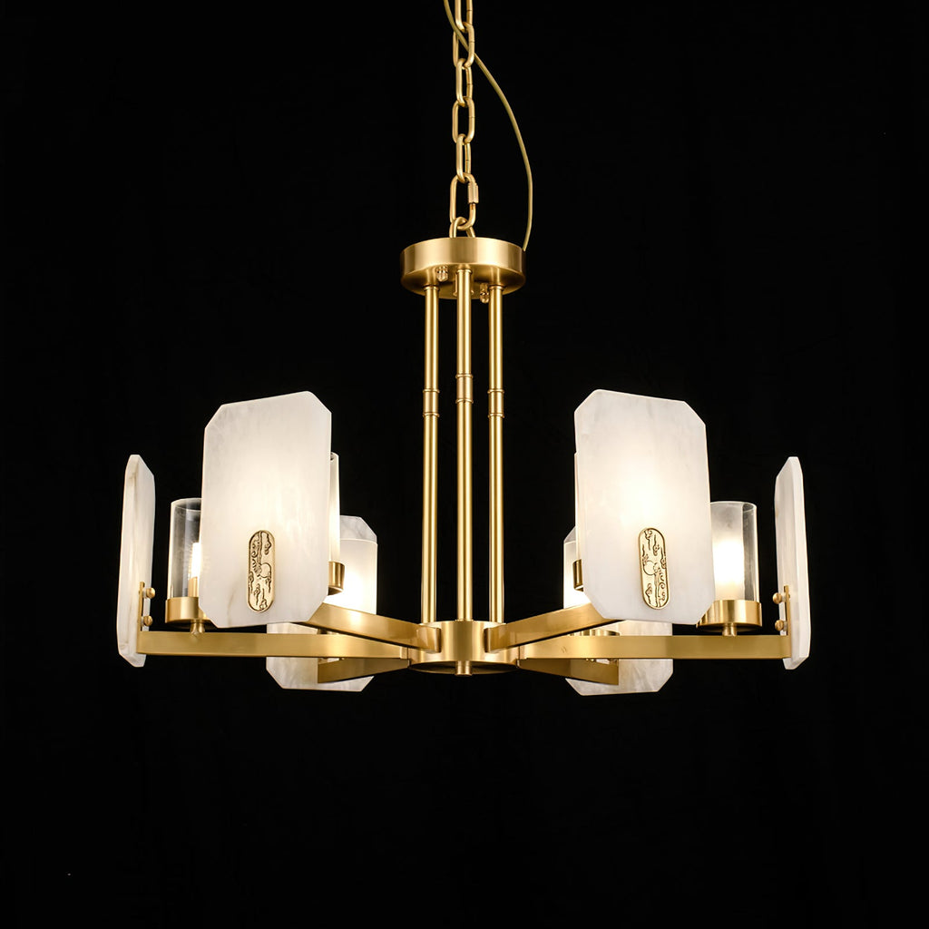 Clérachic Meridian Alabaster Chandelier lit against black, the alabaster panels holding a soft glow behind each clear glass cylinder.