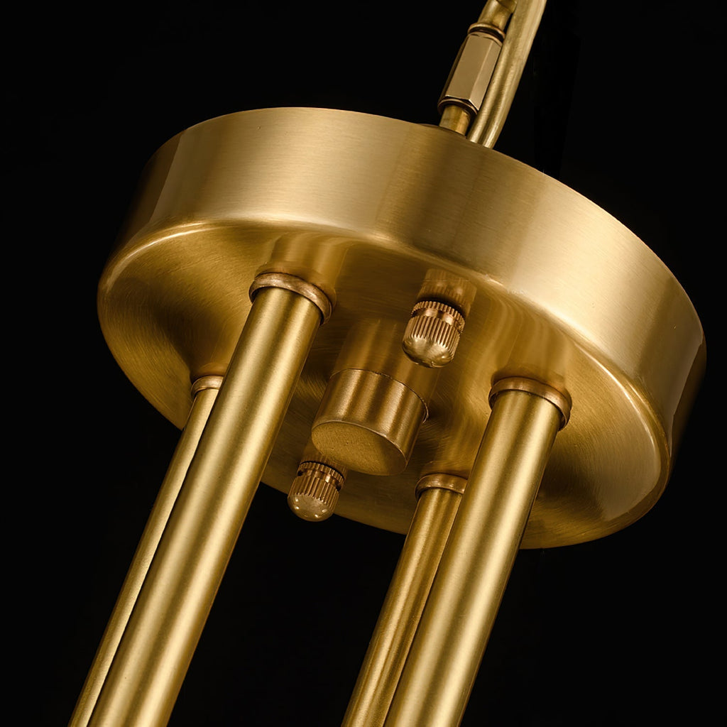 Clérachic Meridian Alabaster Chandelier detail, the brushed brass ceiling plate with knurled screws holding the three stems.