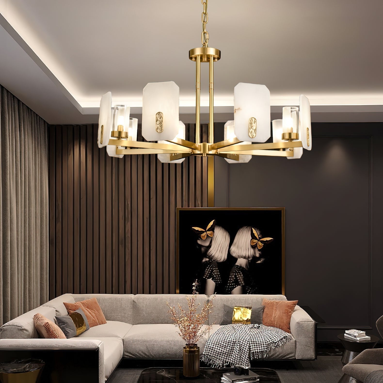 Clérachic Meridian Alabaster Chandelier lit in a dark-panelled lounge, its warm heads set against charcoal walls and a framed print.