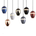 Clérachic acorn pendants in navy, rose gold, white, chrome, grey, black, and bronze hang at staggered heights.