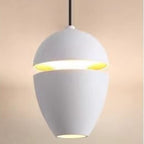 Clérachic matte white acorn pendant with a gold-toned interior glow through the horizontal gap.