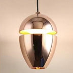 Clérachic polished rose-gold acorn pendant reflecting studio light around a bright mid-body slit.