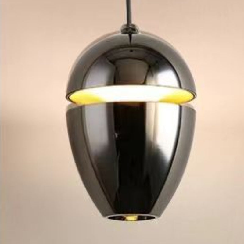Clérachic gunmetal chrome acorn pendant with a gold interior glow through the horizontal gap.