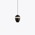 Clérachic matte black studio close-up of the two-piece acorn shade and its warm slit.