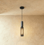 Clérachic slim cylindrical mesh pendant, 6.5 cm wide and 35 cm tall, with a grey stone-look top and warm filament bulb