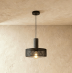 Clérachic flat-drum black mesh pendant on a grey cylindrical collar, with a globe filament bulb showing beneath