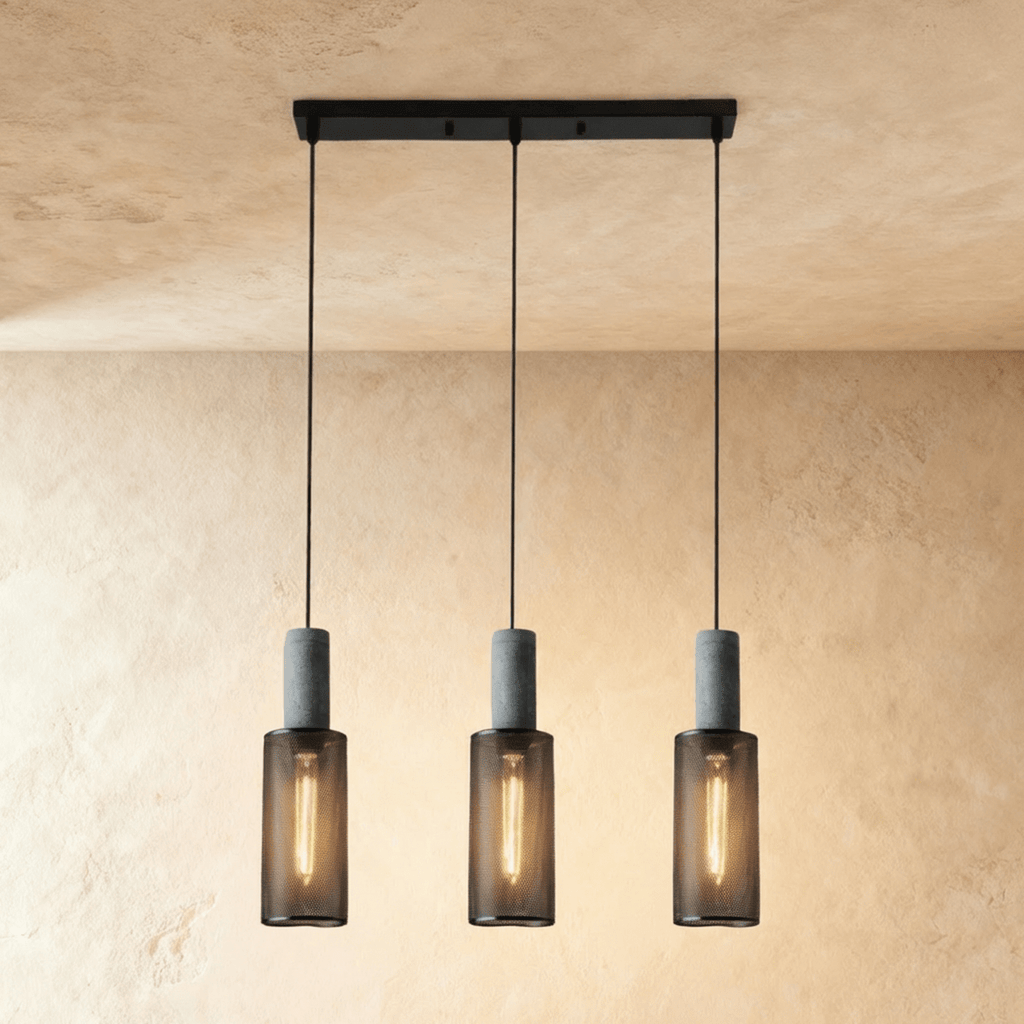 Clérachic linear pendant with three slim mesh cylinders on a black bar canopy, each lit by a filament bulb