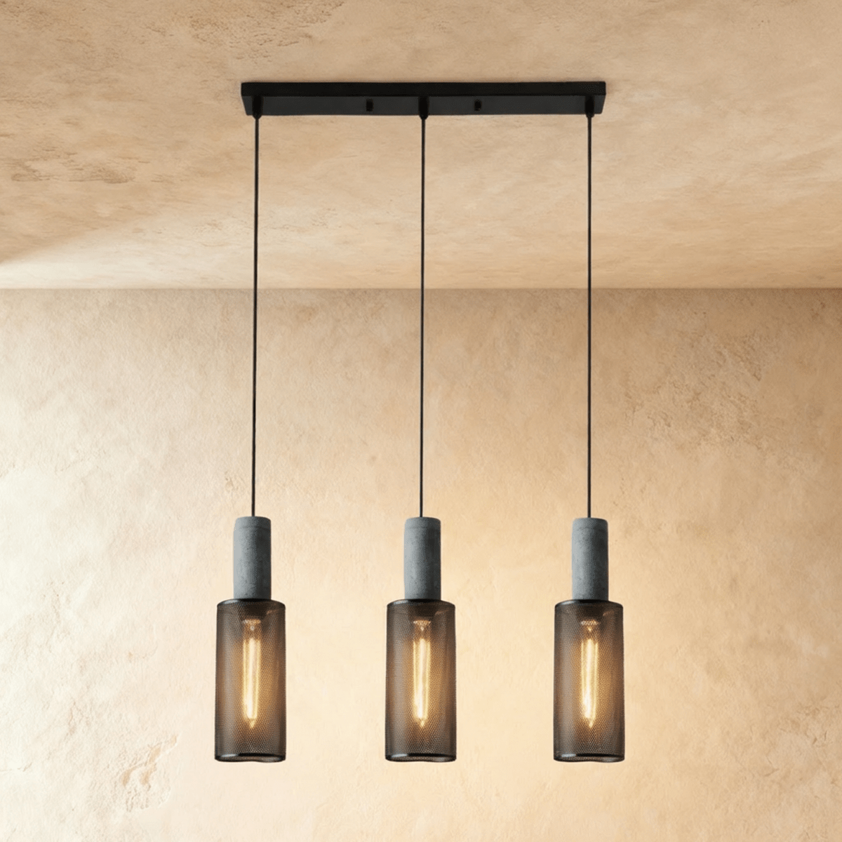 Clérachic linear pendant with three slim mesh cylinders on a black bar canopy, each lit by a filament bulb