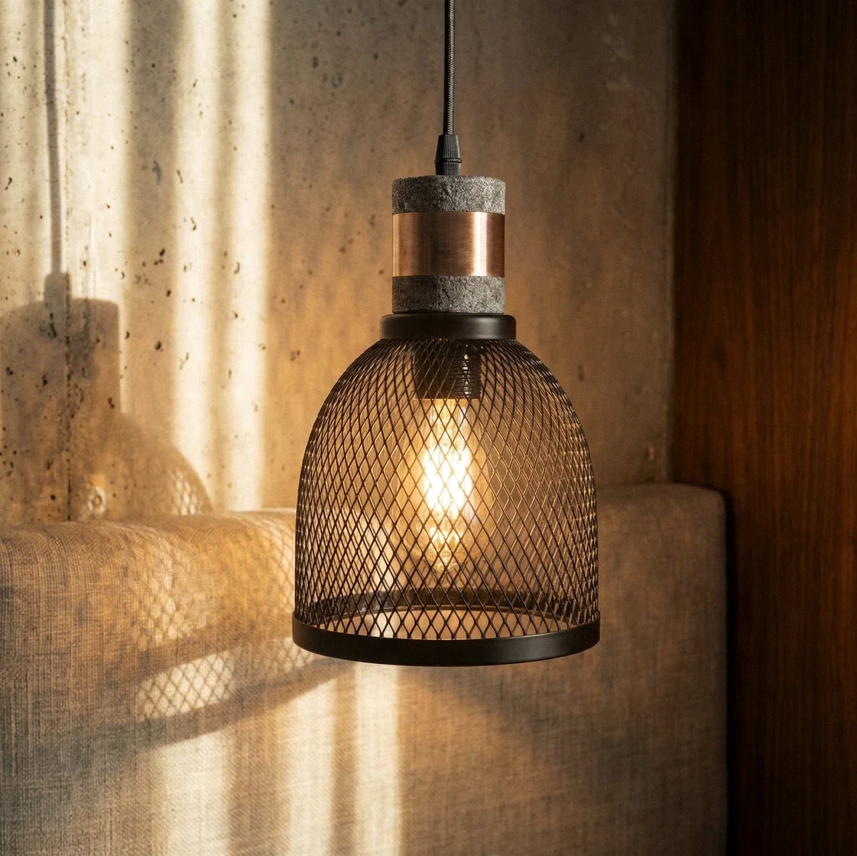 Clérachic domed black mesh pendant lit in low sunlight, with a grey collar and a copper-toned band