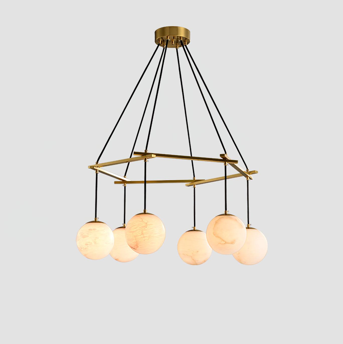 The six-orb Clérachic Miira chandelier, alabaster globes hung around a brass ring.