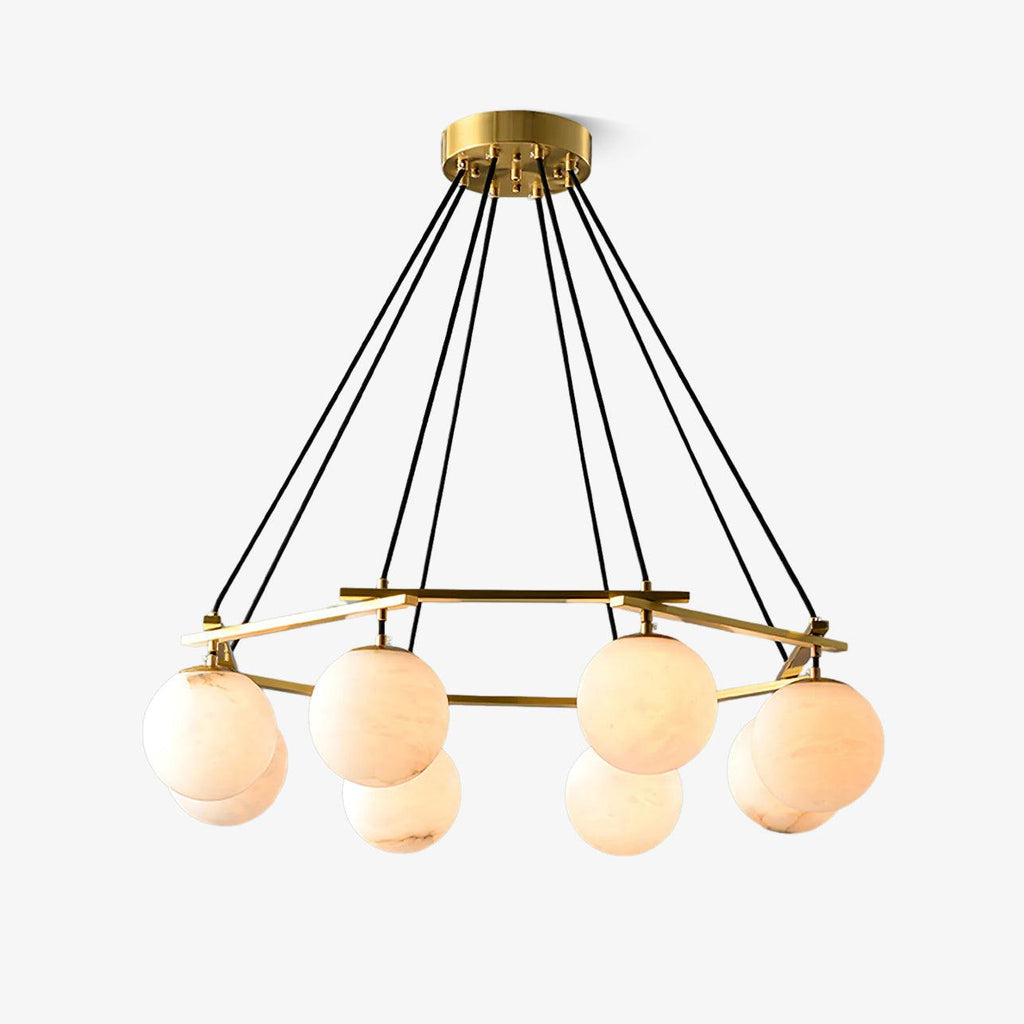 The seven-orb Clérachic Miira chandelier, globes staggered around the brass armature.