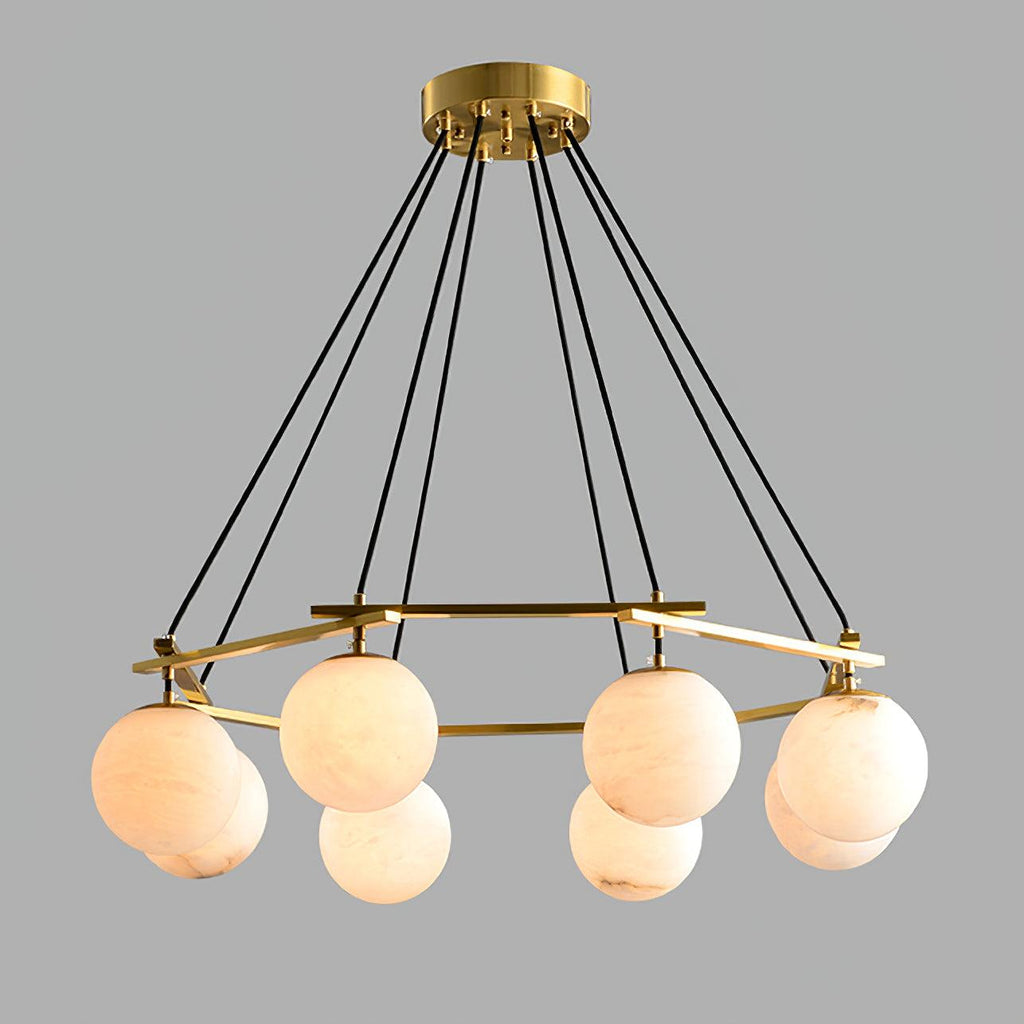 Clérachic Miira chandelier at its widest, alabaster orbs ringing the full brass frame.