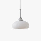 Clérachic pendant light in a room setting over a bedroom.
