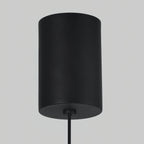 Detail of the matte black cylindrical ceiling mount on the Clérachic Mini Discus pendant light, with its round cord.