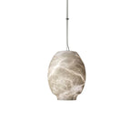 Clérachic alabaster pendant on white, cool grey veining running the height of the oval shade.