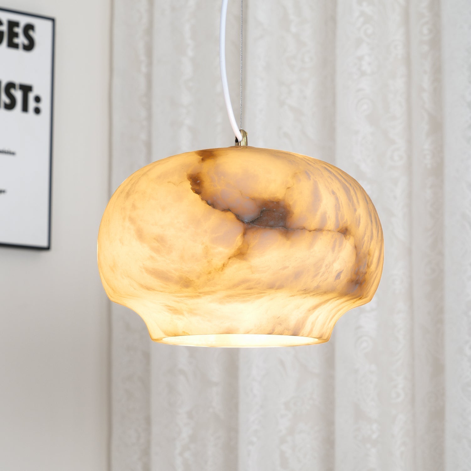 Macro of the Clérachic alabaster shade lit from within, amber tones flooding the stone grain.