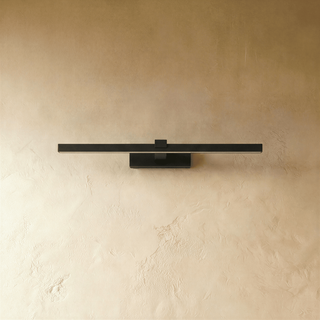 Clérachic slim black linear wall light, 39.5 cm, switched off against a textured limewash wall, showing its square mount.