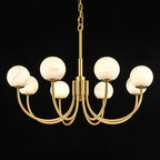Clérachic alabaster globe chandelier on black, eight brass arms curving out beneath a slim chain.