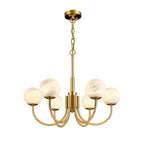 The Clérachic globe chandelier on white, full drop from ceiling canopy through chain to brass arms.