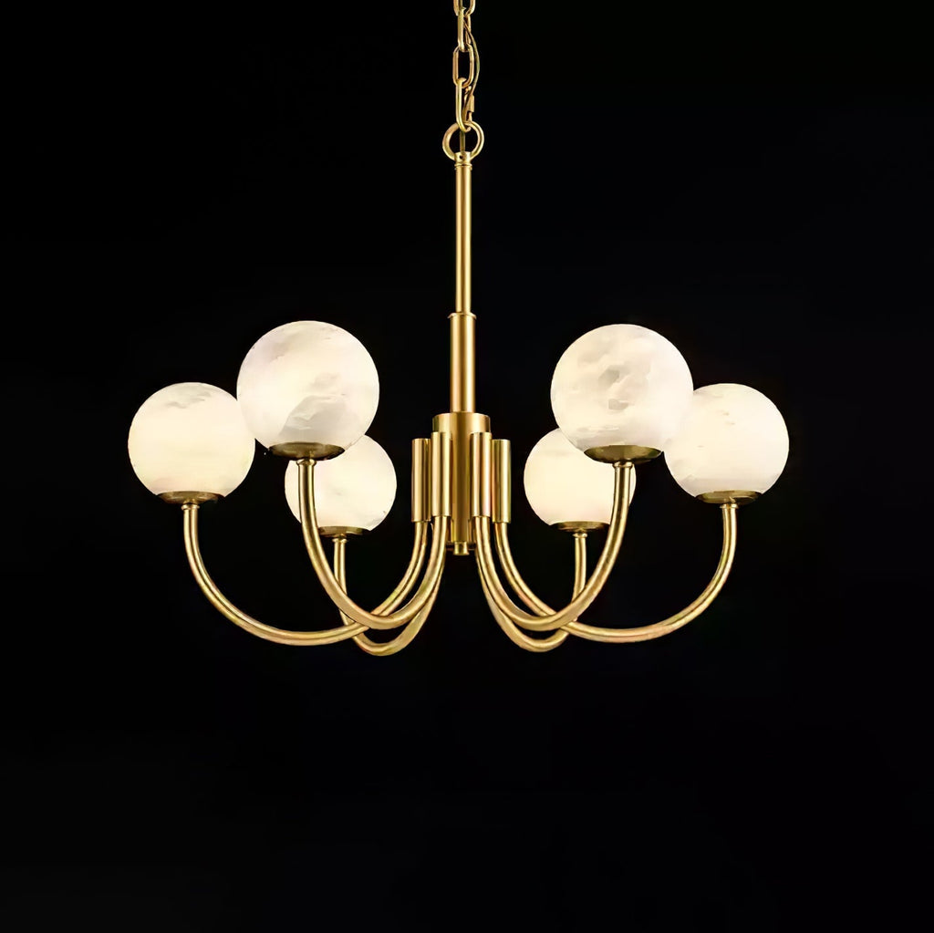 The Clérachic globe chandelier on black, eight alabaster spheres lifted on curved brass arms.