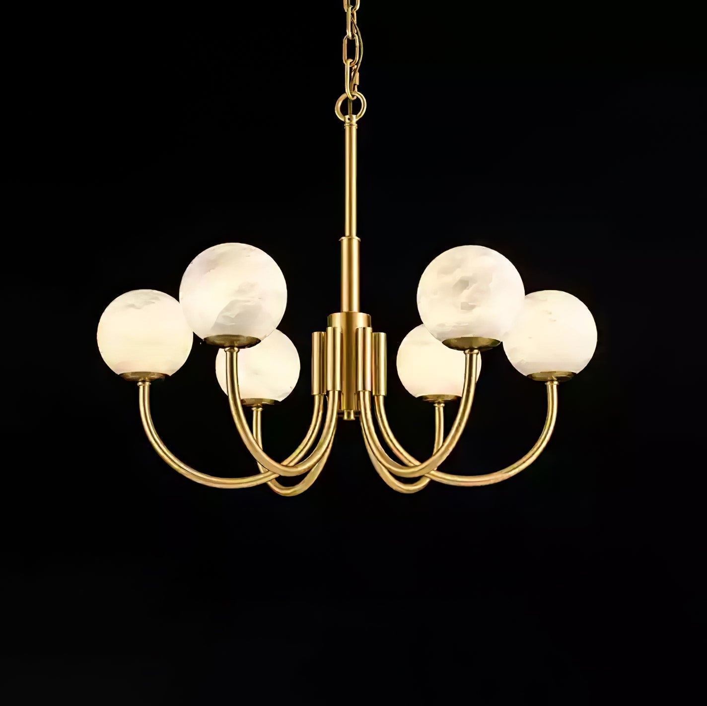 The Clérachic globe chandelier on black, eight alabaster spheres lifted on curved brass arms.