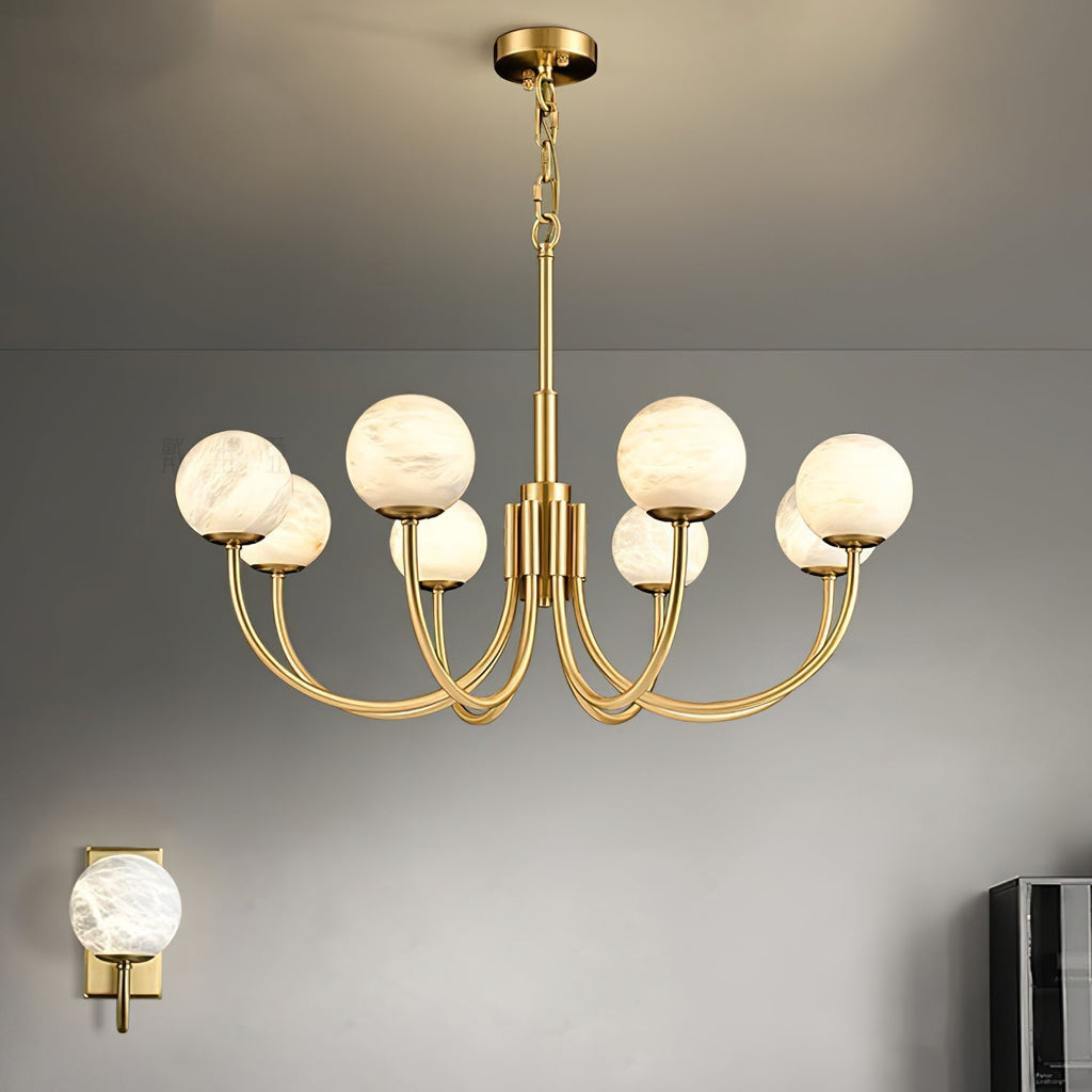 Clérachic globe chandelier on a pale wall, a small matching sconce visible at the frame edge.