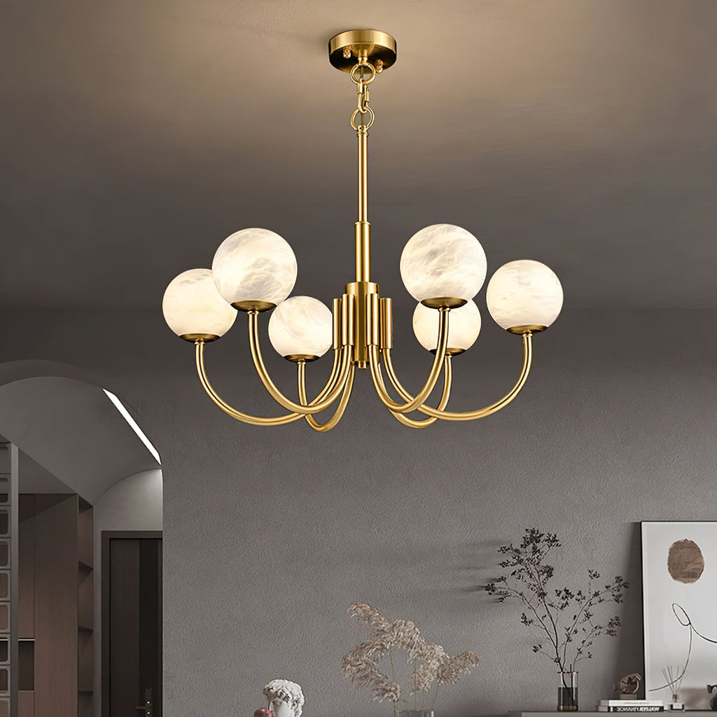 The Clérachic globe chandelier above a dining setting in a softly arched, art-hung room.