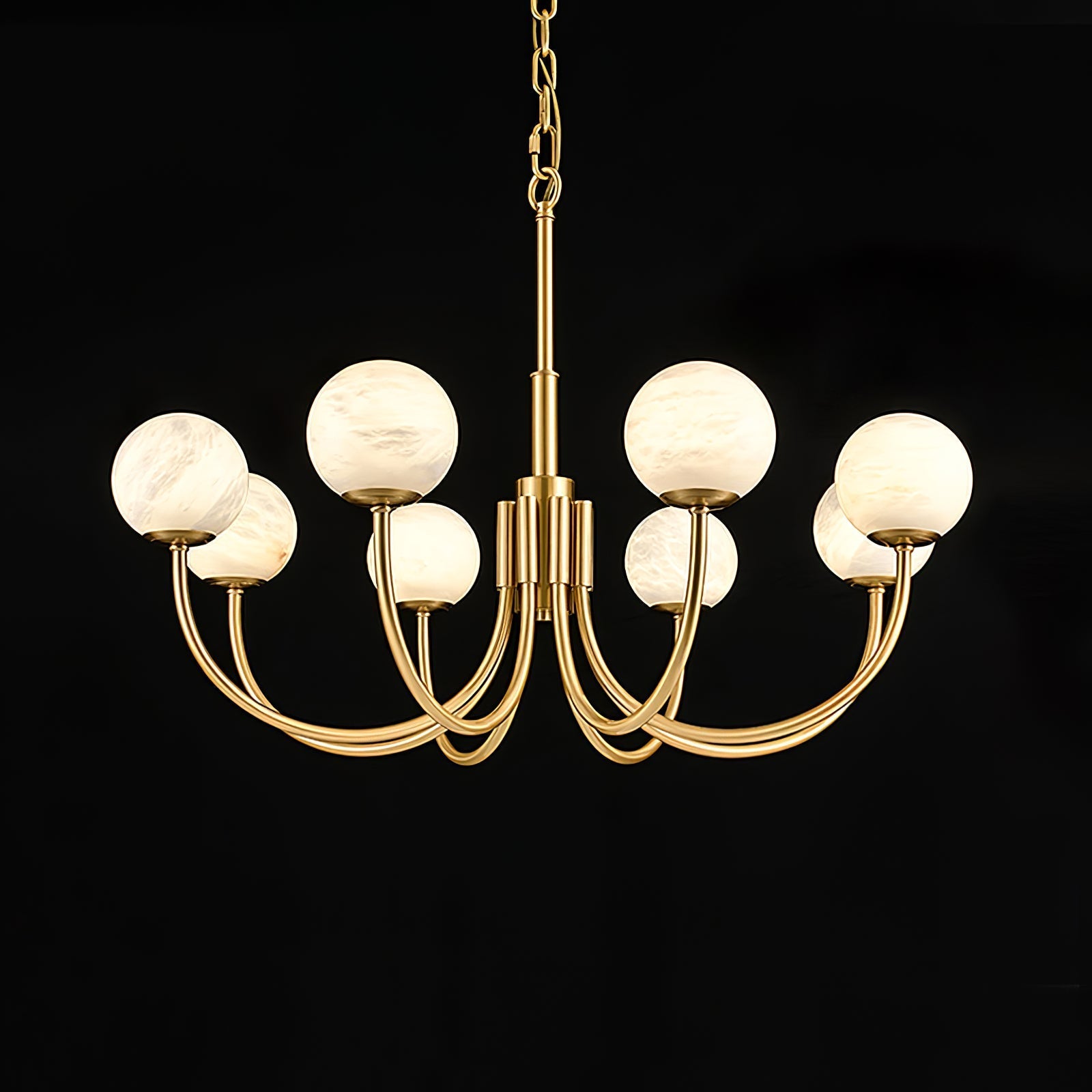 The Clérachic globe chandelier centred on black, brass arms symmetrical around the stem.