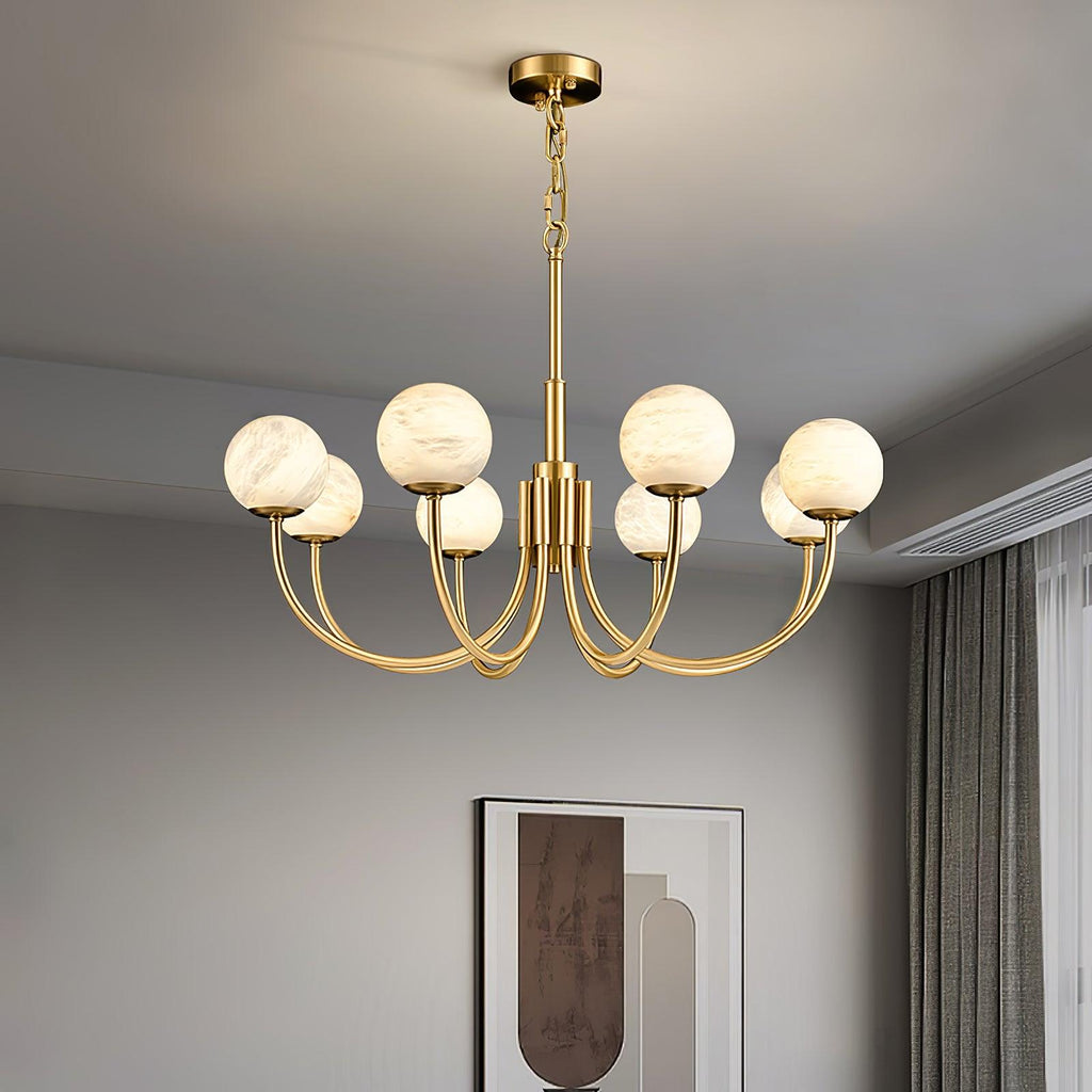 Clérachic globe chandelier lit below a white ceiling beside framed art and sheer curtains.