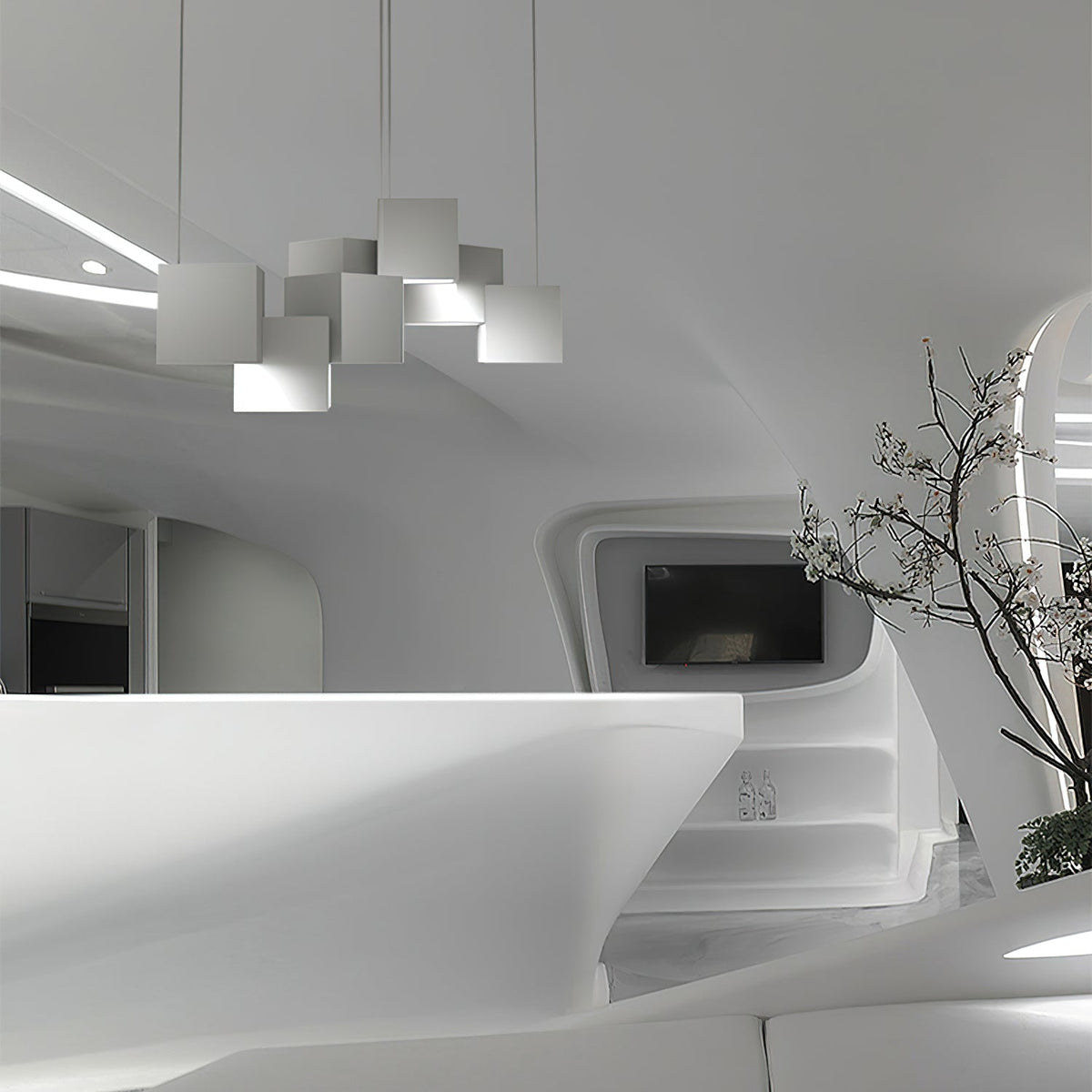 A Clérachic chandelier of white cubes seen from a distance in a curved white interior, with a branch in a vase to the right.