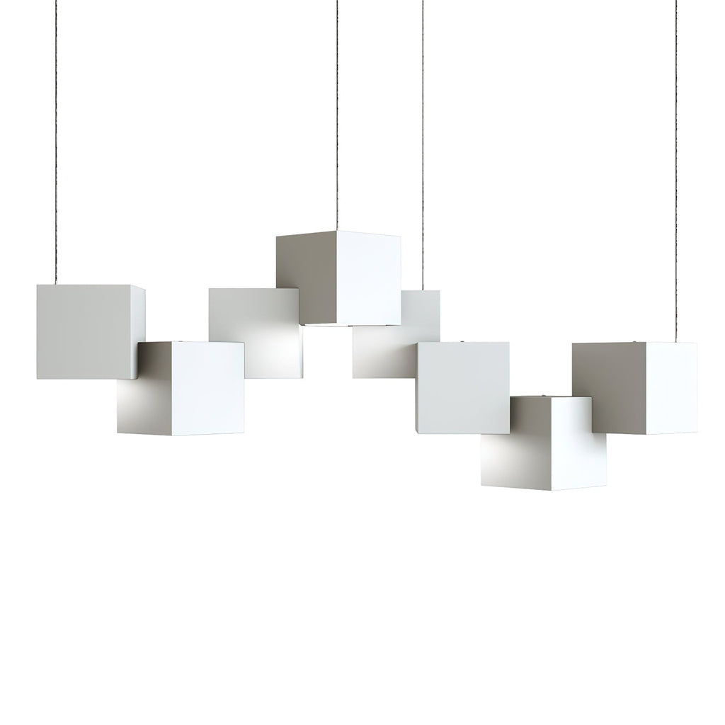 A white Clérachic cube chandelier on a plain white backdrop, with the cubes hung at offset heights on thin wires.