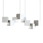 A white Clérachic cube chandelier on a plain white backdrop, with the cubes hung at offset heights on thin wires.