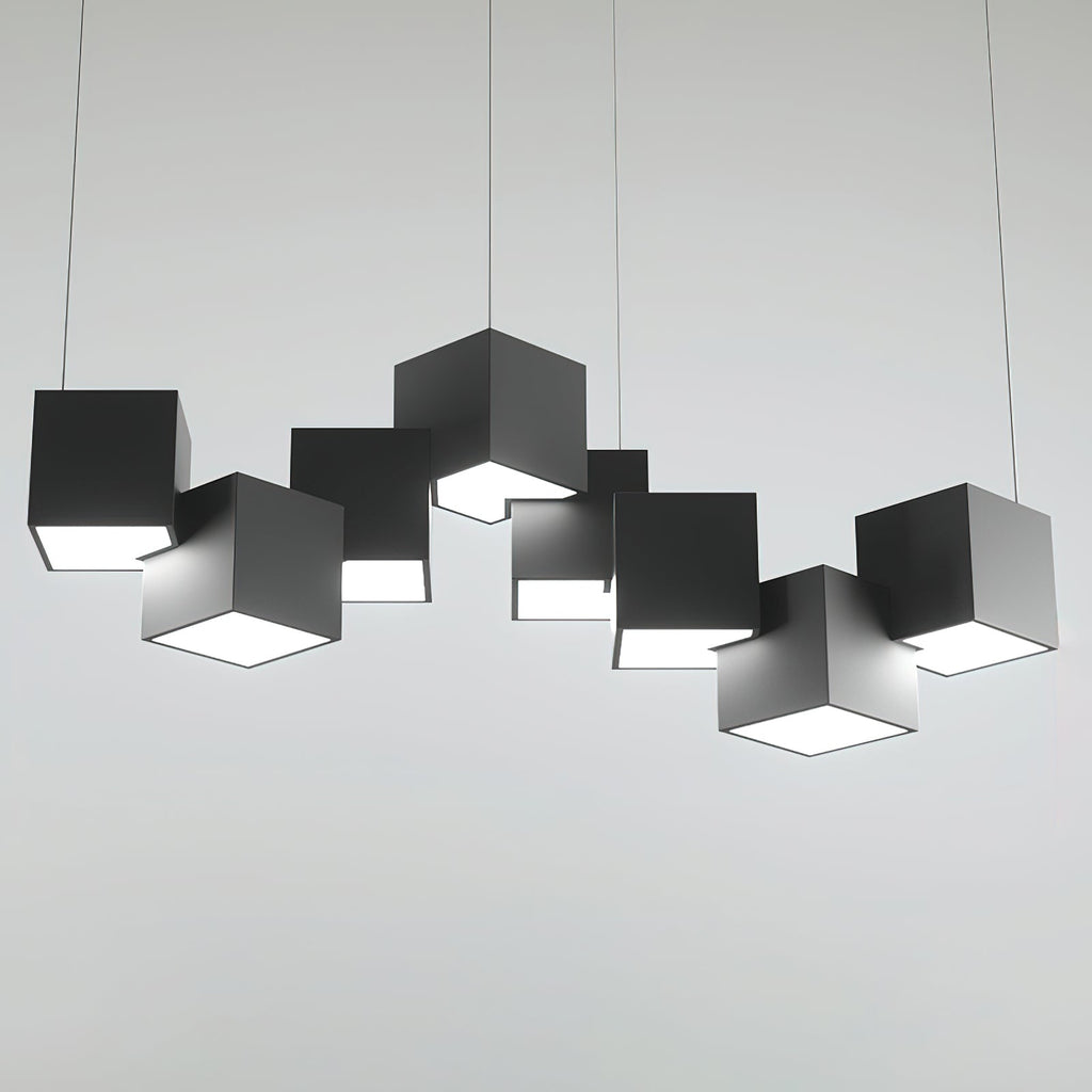 A Clérachic chandelier of black cubes on a light grey backdrop, in a wide row with a lit opening beneath each.