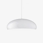 Glossy white dome pendant from Clérachic on a plain white backdrop, hanging from a thin cable with a pale underside.
