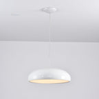 Glossy white Clérachic dome pendant lit from below, with a bright diffuser and a rounded white canopy above.