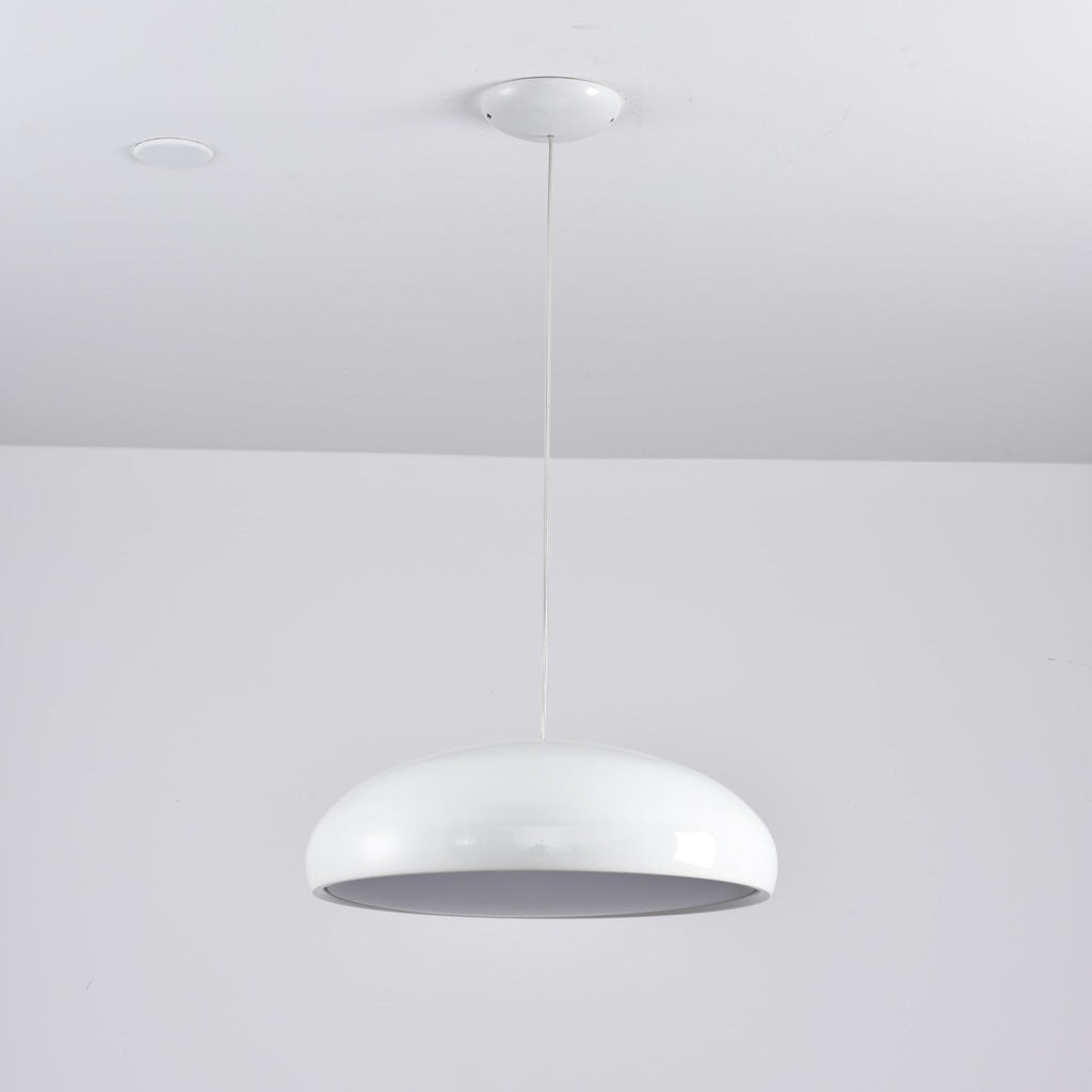 White Clérachic dome pendant seen from beneath, with its unlit grey diffuser visible beside a ceiling spotlight.