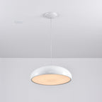 White Clérachic dome pendant tilted to show its warm, lit diffuser, hung from a white round canopy.