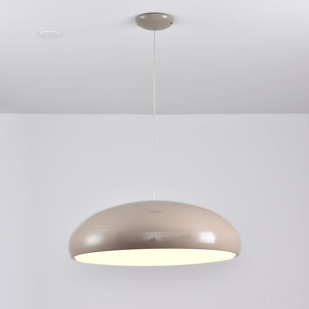 Warm grey Clérachic dome pendant lit from below, with a matching grey ceiling canopy and a glossy shell.