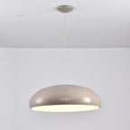 Warm grey Clérachic dome pendant lit from below, with a matching grey ceiling canopy and a glossy shell.