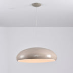 Warm grey Clérachic dome pendant seen straight on, with a soft peach glow at its lower edge.