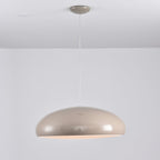 Warm grey Clérachic dome pendant with a faint warm glow at its rim, hung from a matching grey canopy.