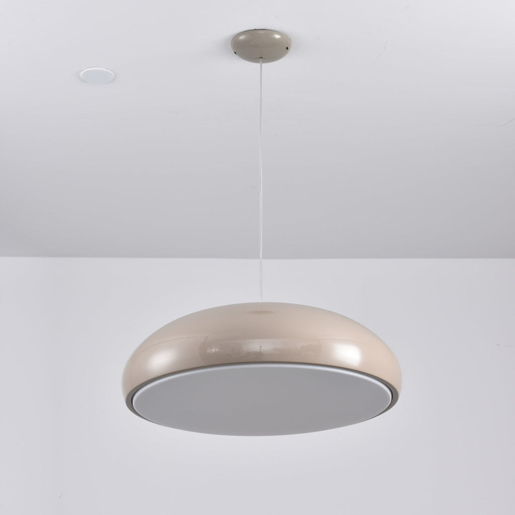 Warm grey Clérachic dome pendant tilted to show its flat grey diffuser disc, hung beside a ceiling spotlight.