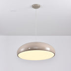 Warm grey Clérachic dome pendant with a bright cream diffuser lit from below, hung from a matching ceiling canopy.
