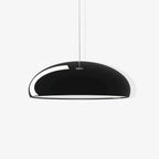 Gloss black Clérachic dome pendant on a pale backdrop, with a small metal cap at the top where the cable meets the shade.